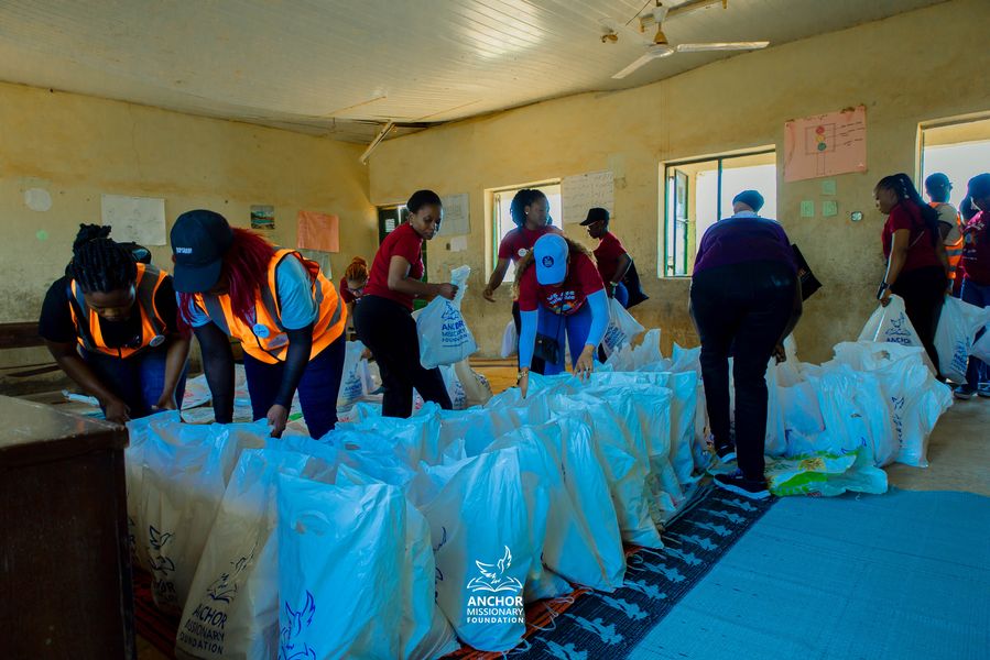 Volunteers packing relief bags in a classroom ahead of distribution